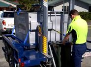 Trailer-Mounted Bin Lifter